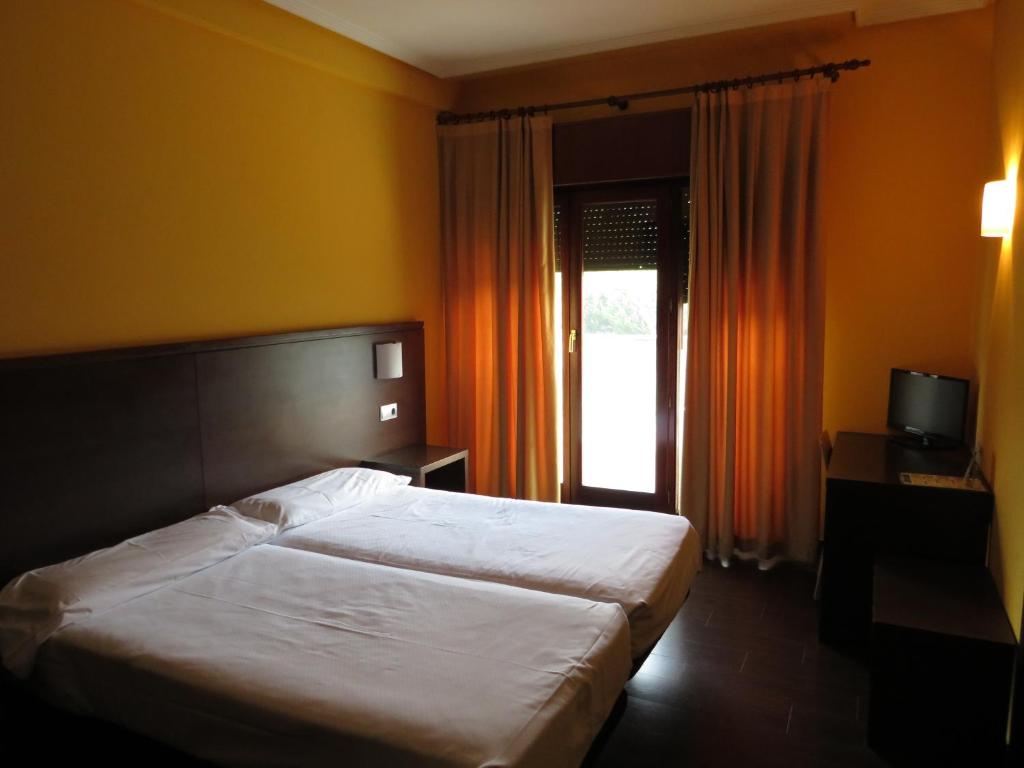 Postel nebo postele na pokoji v ubytování Euba Hotel