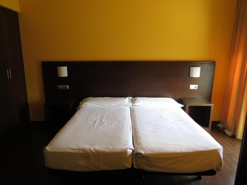 Postel nebo postele na pokoji v ubytování Euba Hotel