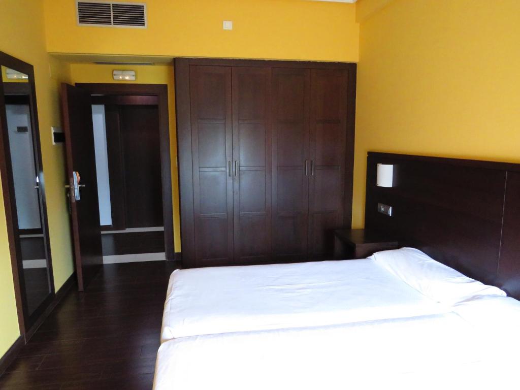 Postel nebo postele na pokoji v ubytování Euba Hotel