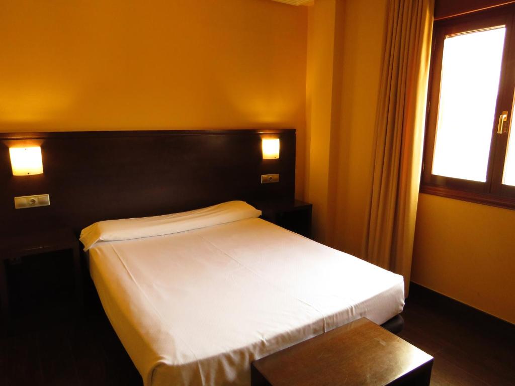 Postel nebo postele na pokoji v ubytování Euba Hotel