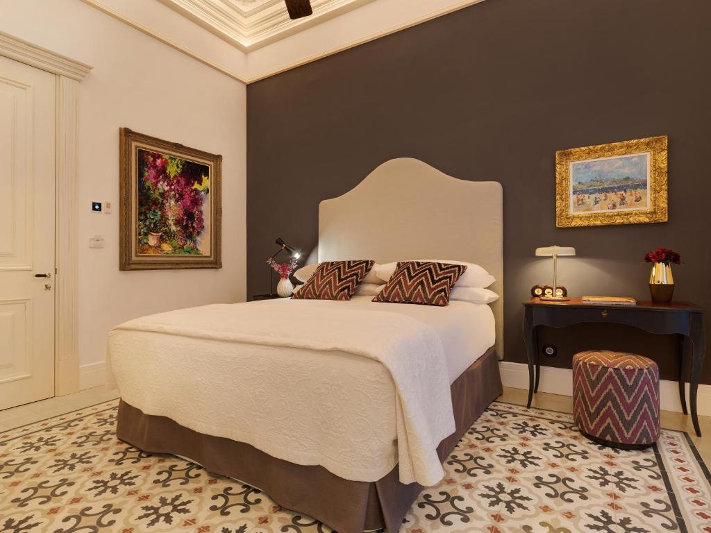 Postel nebo postele na pokoji v ubytování Hotel Gloria de Sant Jaume