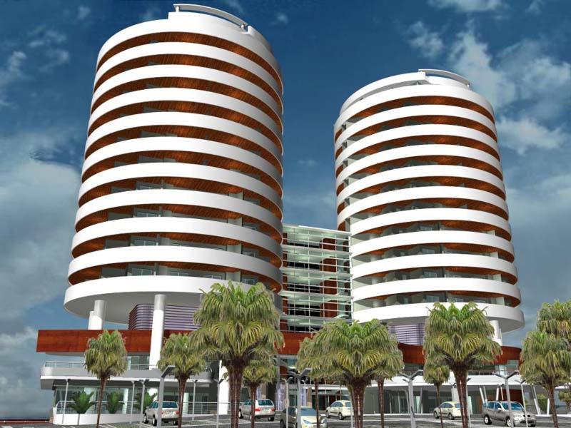 two tall buildings with palm trees in front of them at Torri Camuzzi Exclusive Luxury Apartment in Pescara