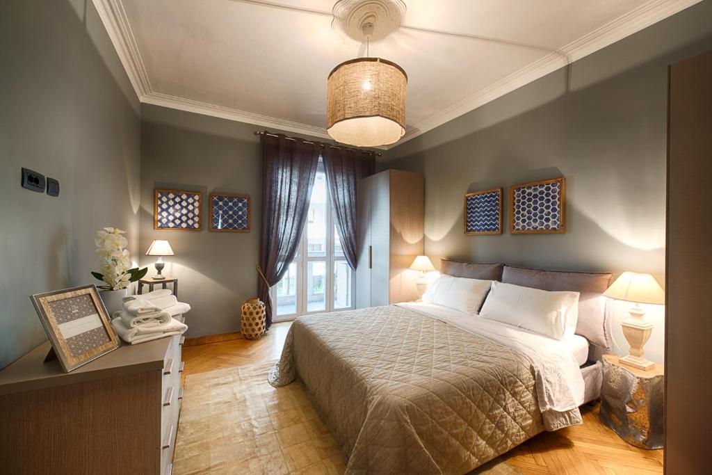 A bed or beds in a room at TORINO VACANCY 1