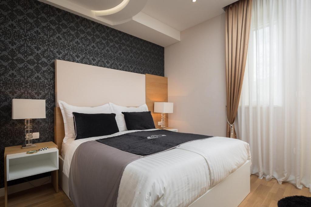 Postel nebo postele na pokoji v ubytování VIP Rooms