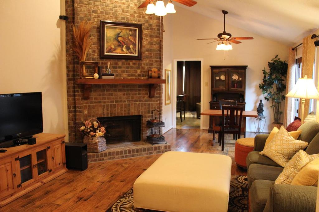 a living room with a couch and a fireplace at Comfy Cozy Affordable Home Away Home in Garland