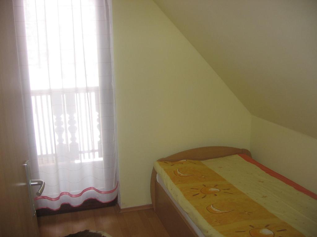 Postel nebo postele na pokoji v ubytování Apartments Gubanec