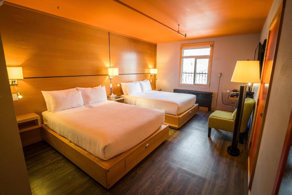 Postel nebo postele na pokoji v ubytování Adventure Hotel
