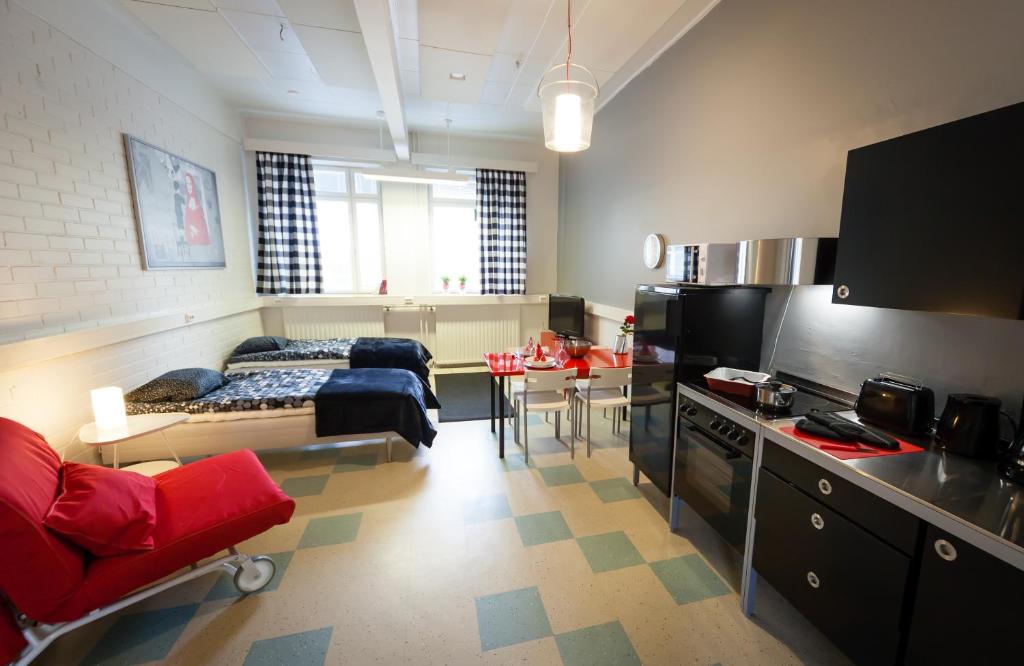 a large living room with a couch and a table at Yömyssy Apartments in Kerimäki