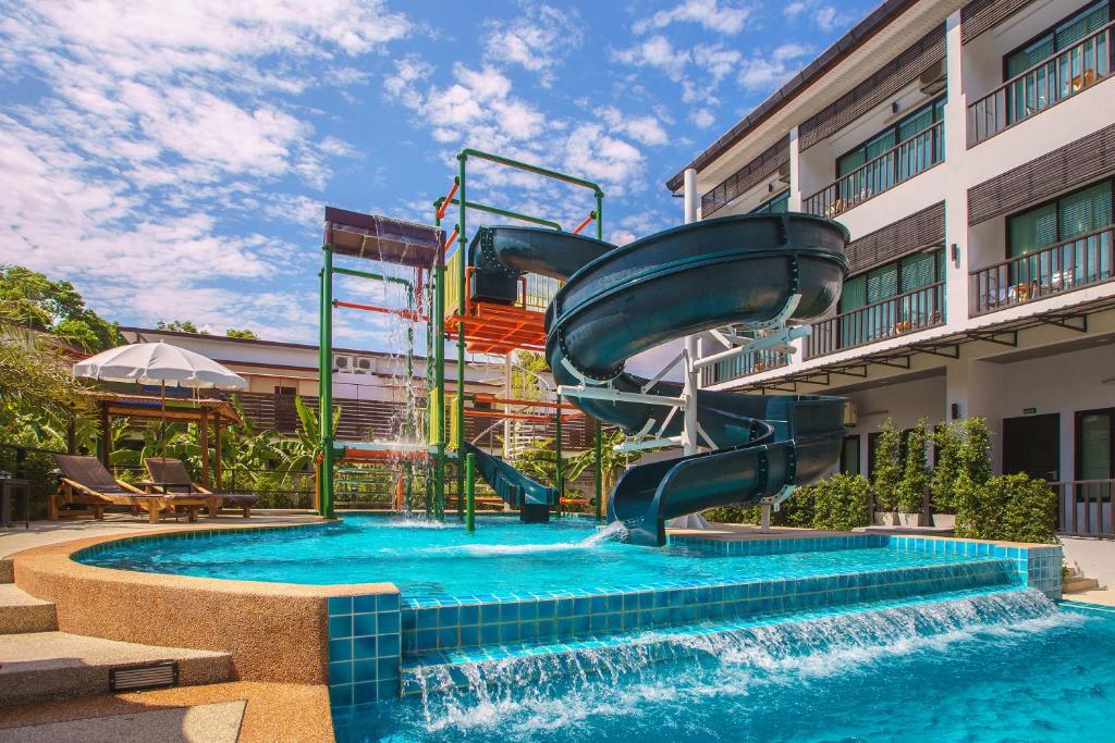 a water slide in a pool at a hotel at Aonang Viva Resort - SHA Plus in Ao Nang Beach