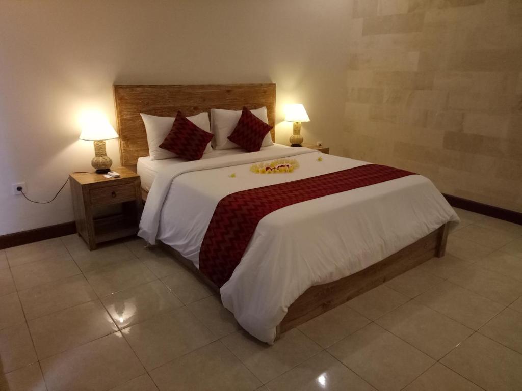 Postel nebo postele na pokoji v ubytování Umah Dajane Guest House