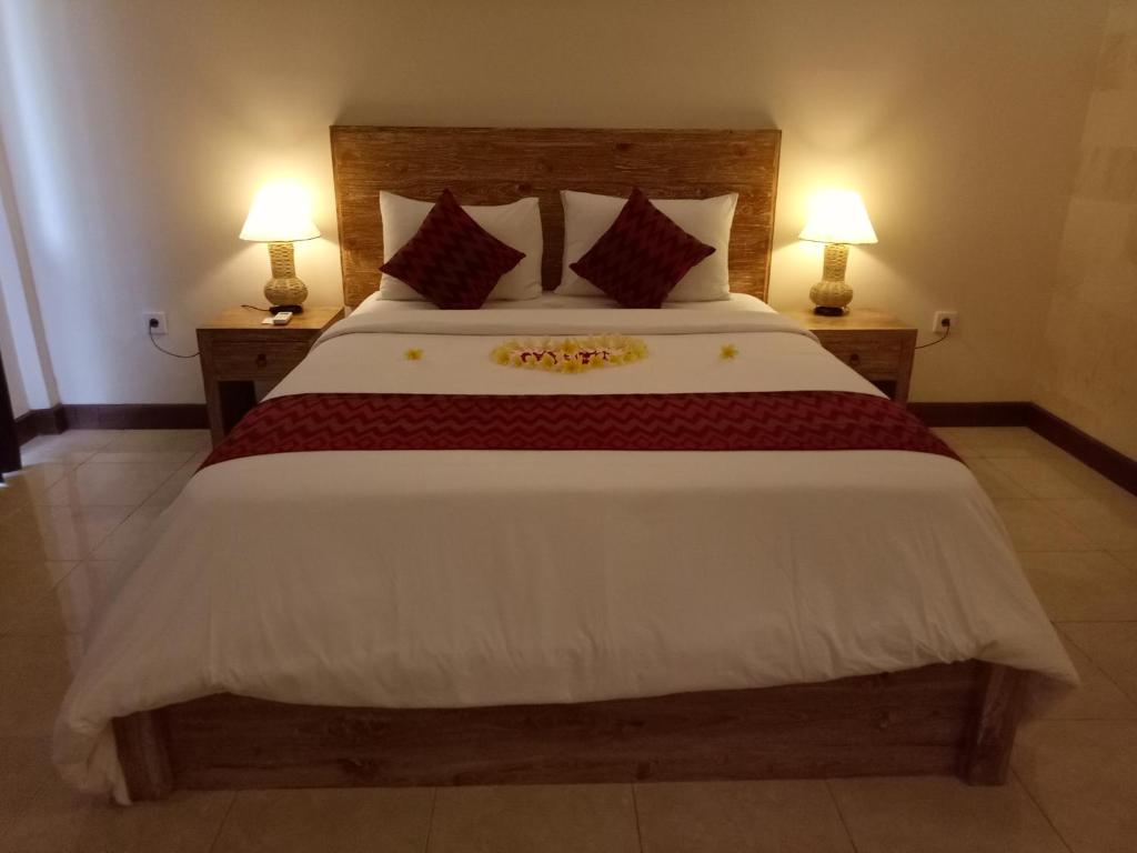 Postel nebo postele na pokoji v ubytování Umah Dajane Guest House