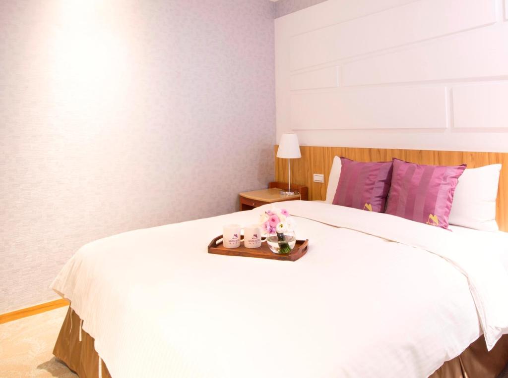 Postel nebo postele na pokoji v ubytování Muzik Hotel - Ximending Xining Branch