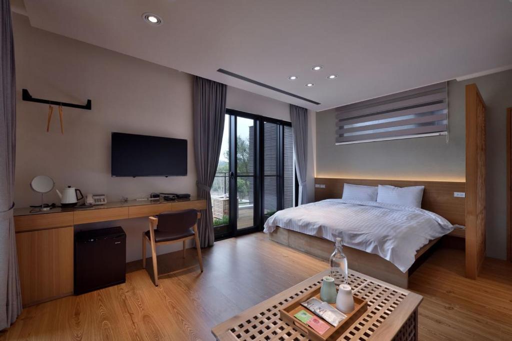 Postel nebo postele na pokoji v ubytování Shan Yi Fang Resort