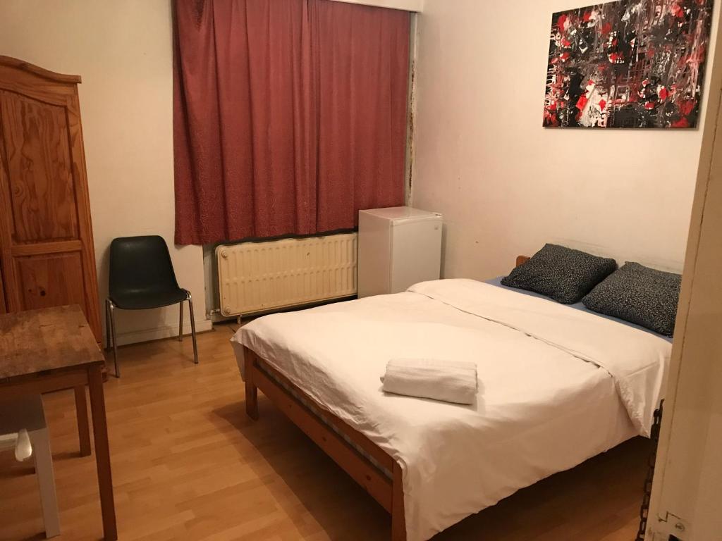
a bedroom with a large bed and a large window at Apartment Zaventem Brussels Airport D in Zaventem
