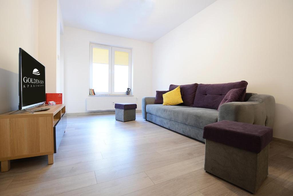 Televízia a/alebo spoločenská miestnosť v ubytovaní Apartament Polanki Park-kryty basen