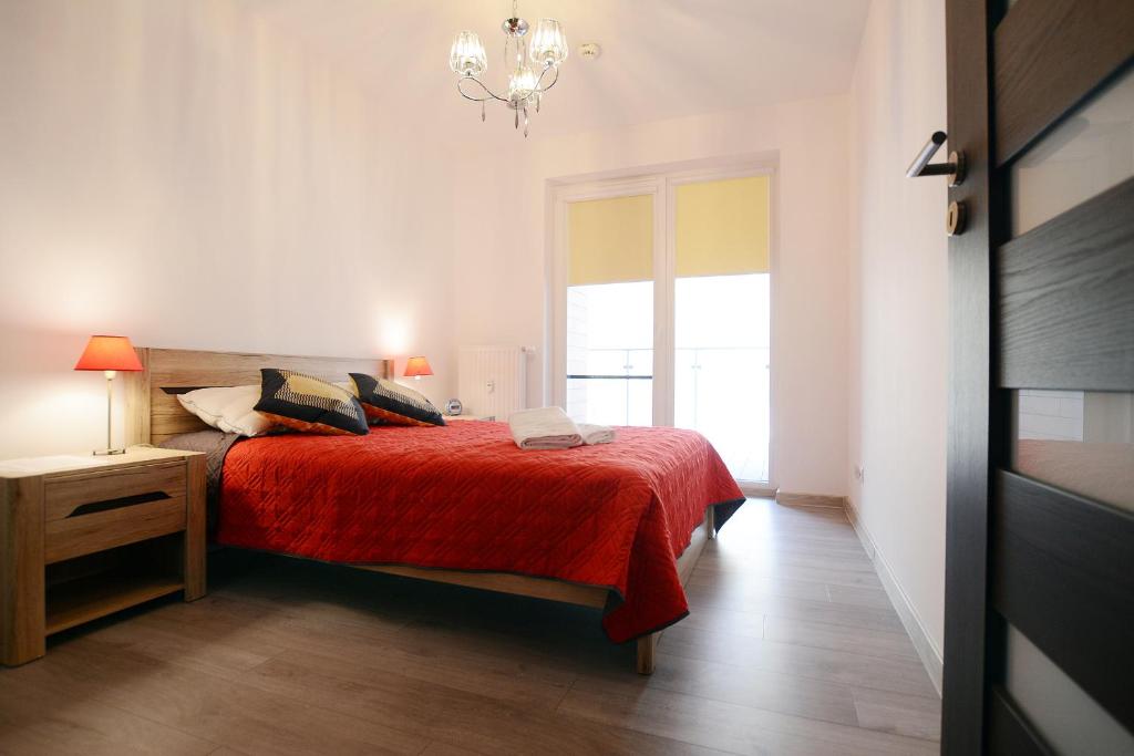 Posteľ alebo postele v izbe v ubytovaní Apartament Polanki Park-kryty basen