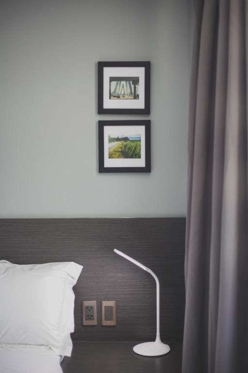 Postel nebo postele na pokoji v ubytování G1 Lodge