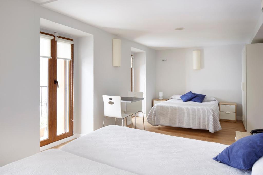 Postel nebo postele na pokoji v ubytování Hotel Olatu
