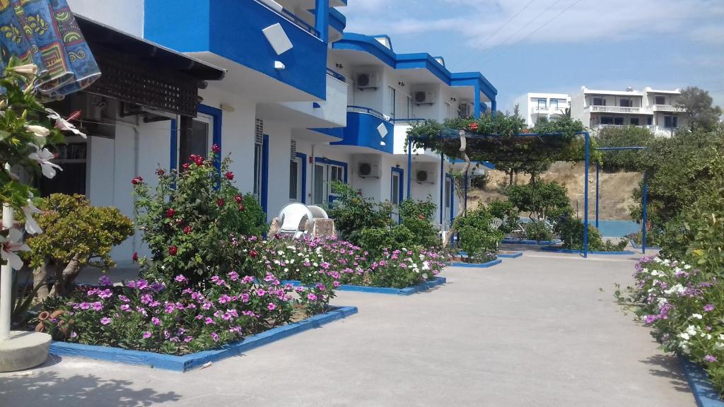 a courtyard of a building with flowers and plants at Maritsa in Kefalos
