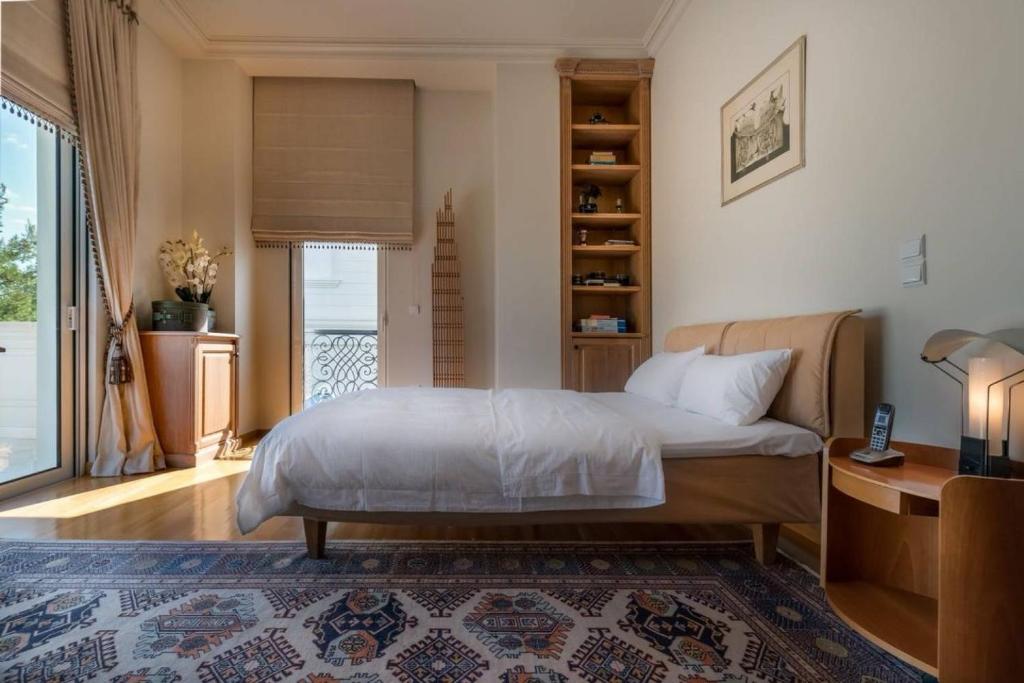Postel nebo postele na pokoji v ubytování Villa Thetis Athens