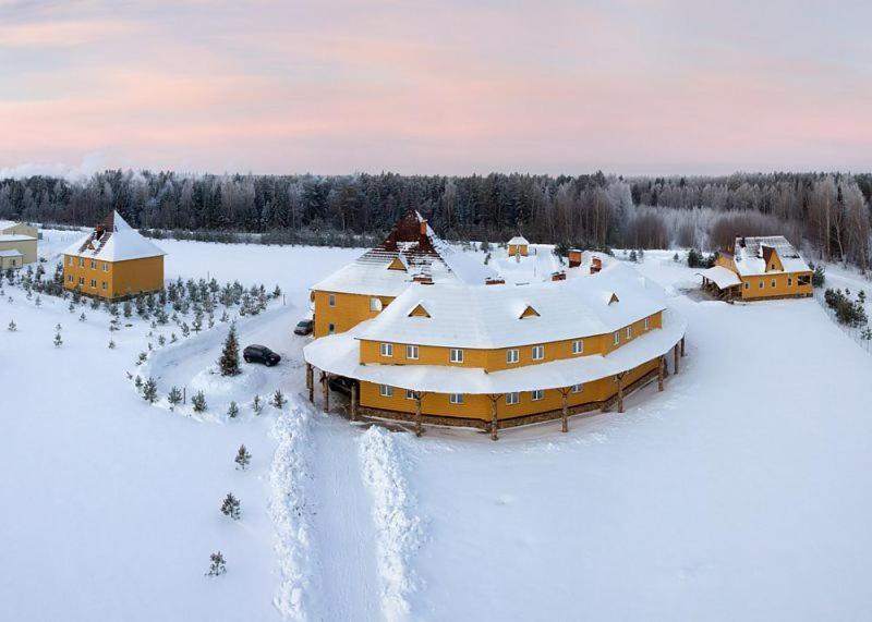 an aerial view of a house covered in snow at Chesnava Holiday Park in Dmitrekhovo