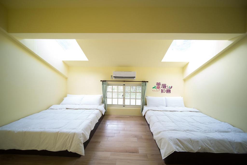 En eller flere senge i et værelse på 鳳林薔薇如画星空民宿