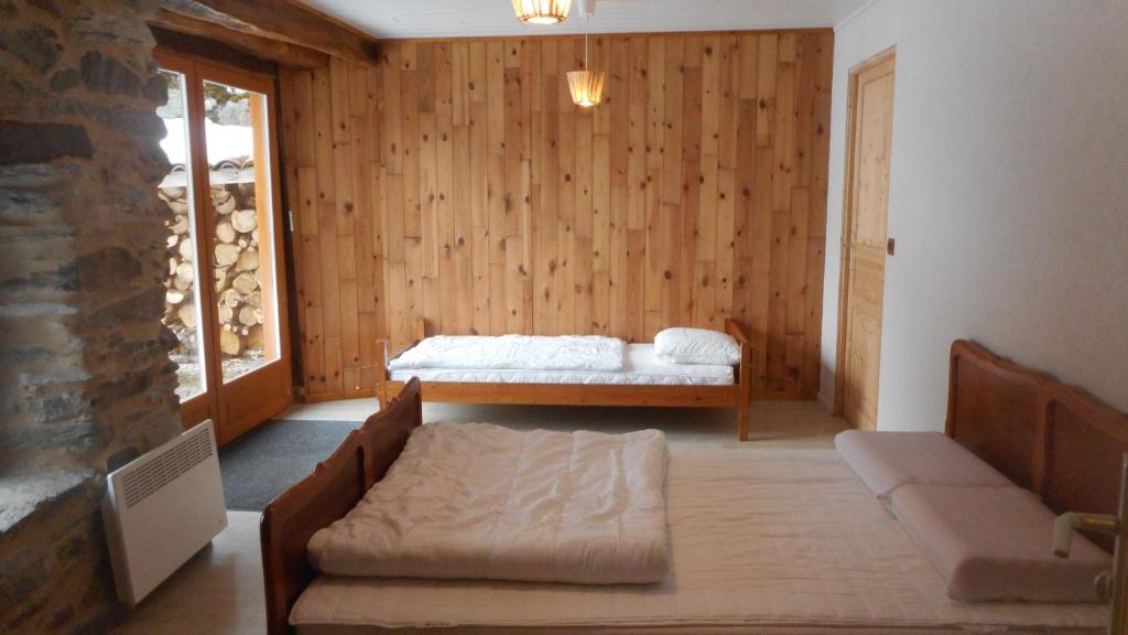 Postel nebo postele na pokoji v ubytování Gîtes Le Paradoxe des Pyrénées