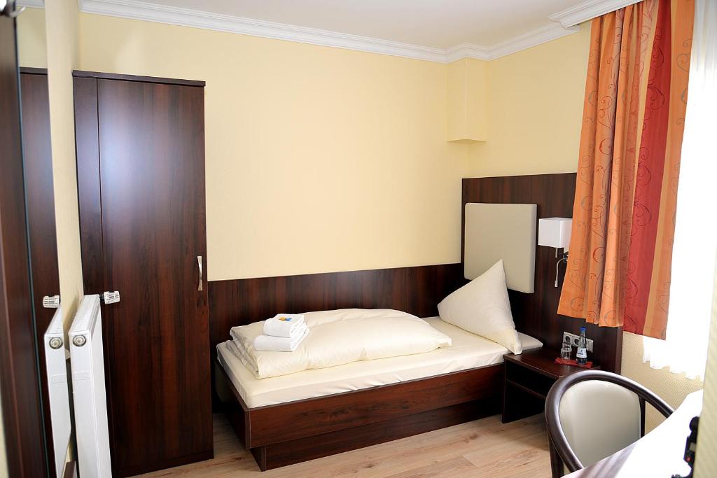 Postel nebo postele na pokoji v ubytování Hotel Neugrabener Hof