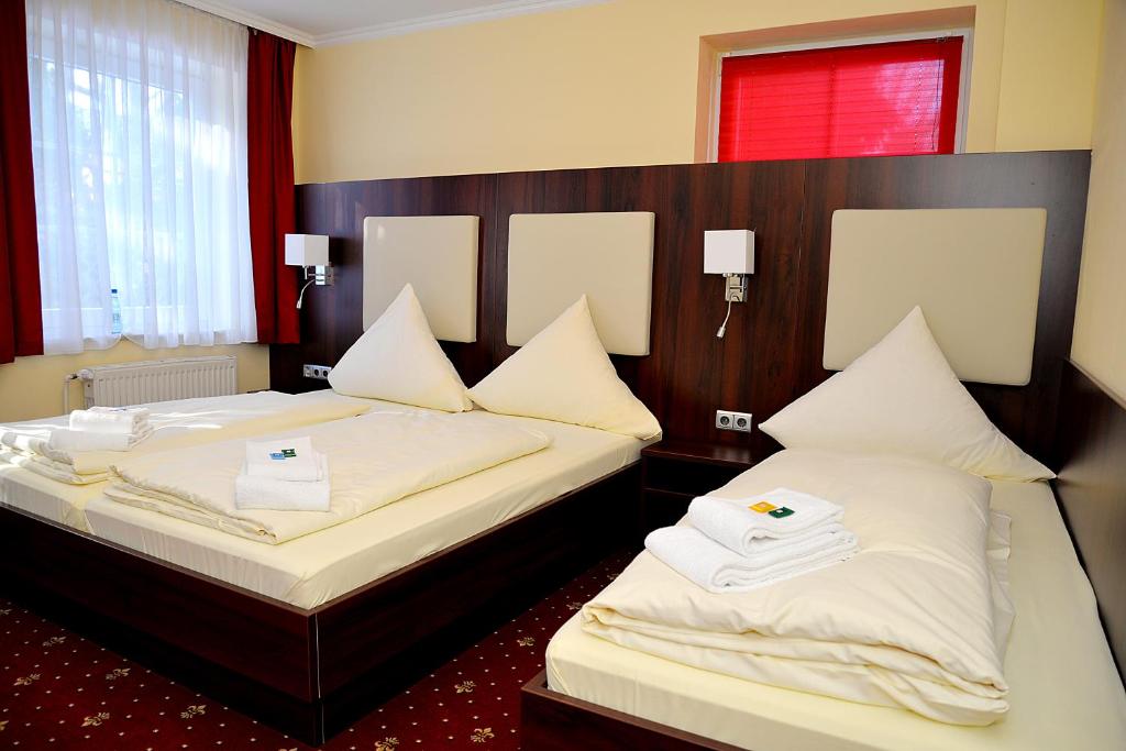 Postel nebo postele na pokoji v ubytování Hotel Neugrabener Hof
