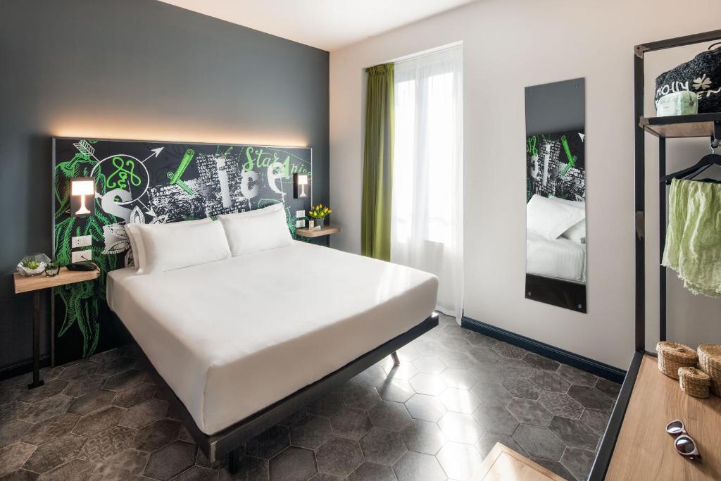 Postel nebo postele na pokoji v ubytování Spice Hotel Milano