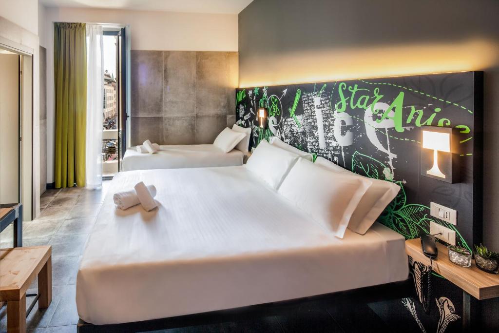 Postel nebo postele na pokoji v ubytování Spice Hotel Milano