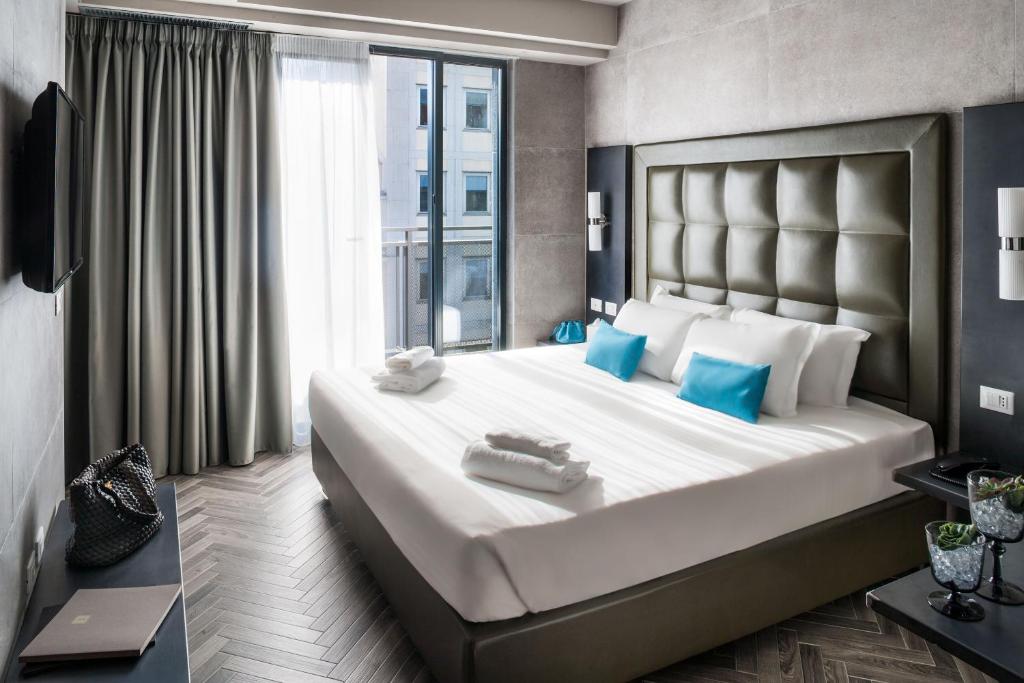 Postel nebo postele na pokoji v ubytování Spice Hotel Milano