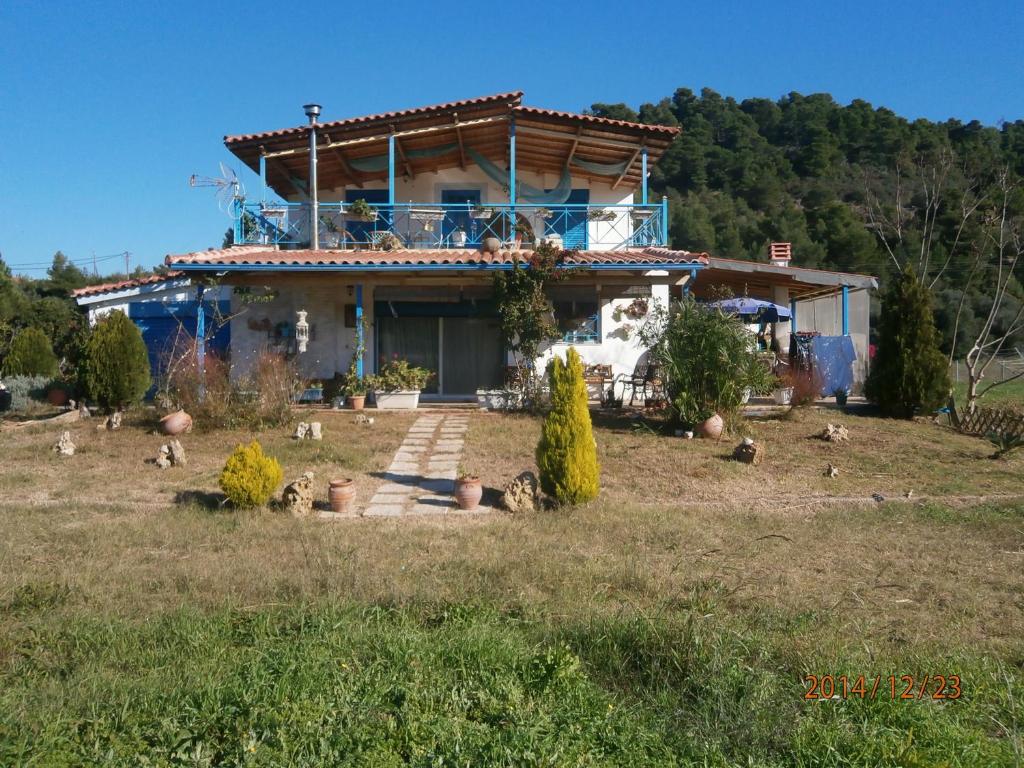 a house sitting on top of a field at Villa Tatiana in Kyparissia