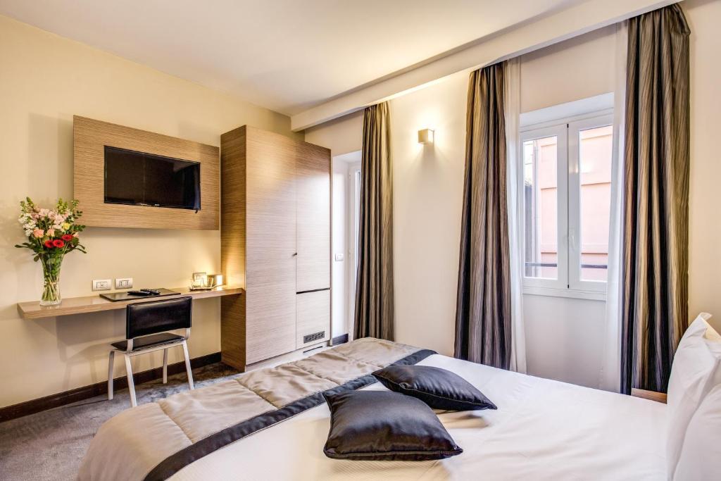 Postel nebo postele na pokoji v ubytování Hotel Trevi - Gruppo Trevi Hotels