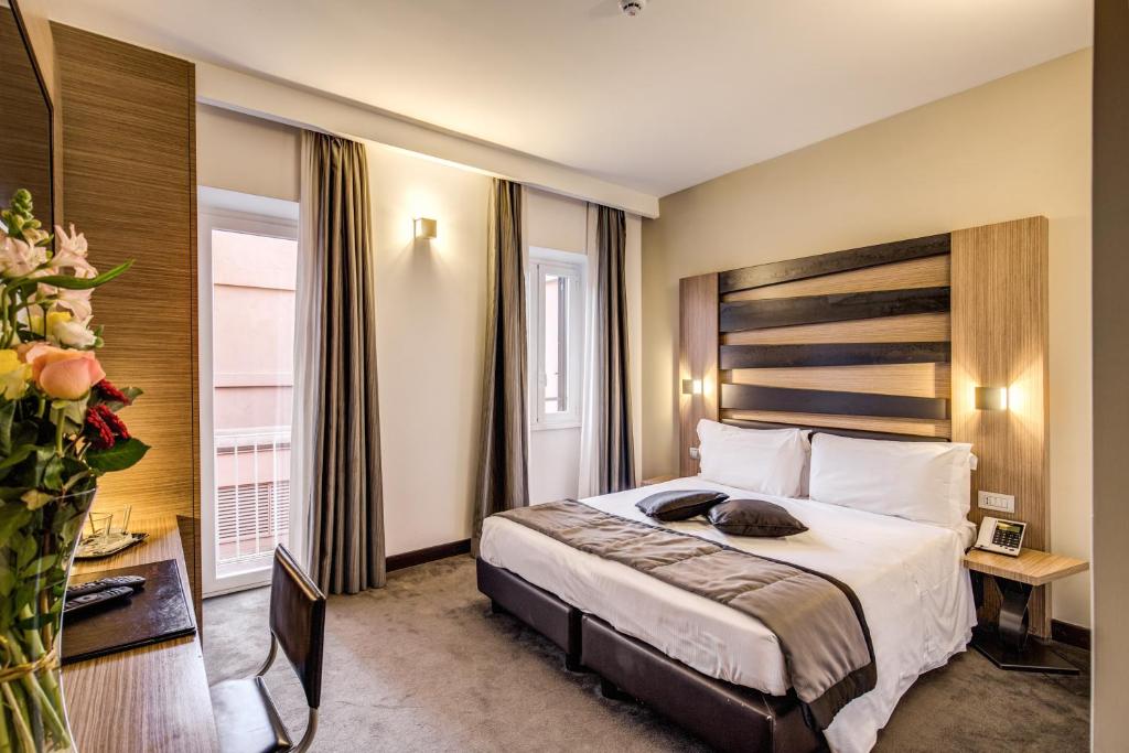 Postel nebo postele na pokoji v ubytování Hotel Trevi - Gruppo Trevi Hotels