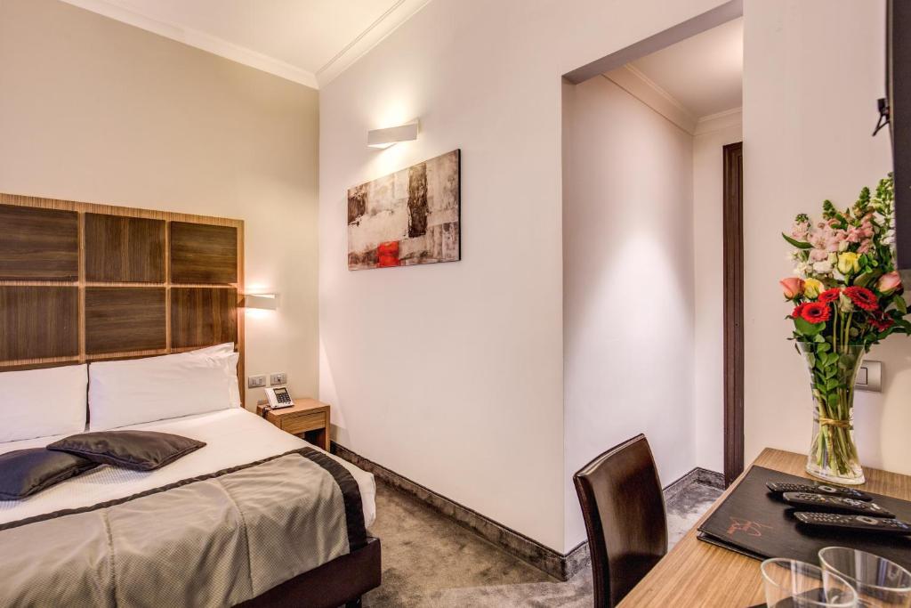 Postel nebo postele na pokoji v ubytování Hotel Trevi - Gruppo Trevi Hotels