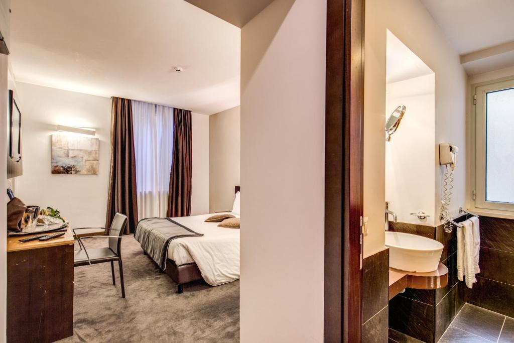 Postel nebo postele na pokoji v ubytování Hotel Trevi - Gruppo Trevi Hotels