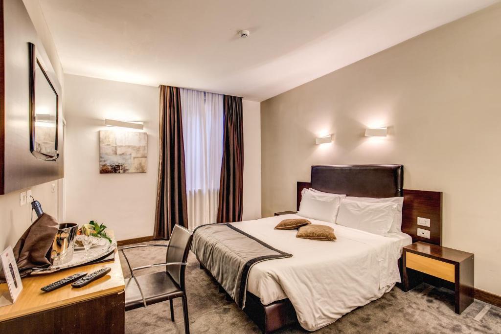 Postel nebo postele na pokoji v ubytování Hotel Trevi - Gruppo Trevi Hotels