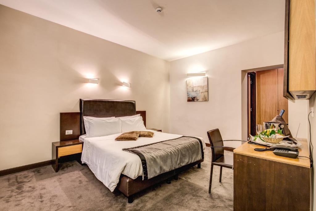 Postel nebo postele na pokoji v ubytování Hotel Trevi - Gruppo Trevi Hotels
