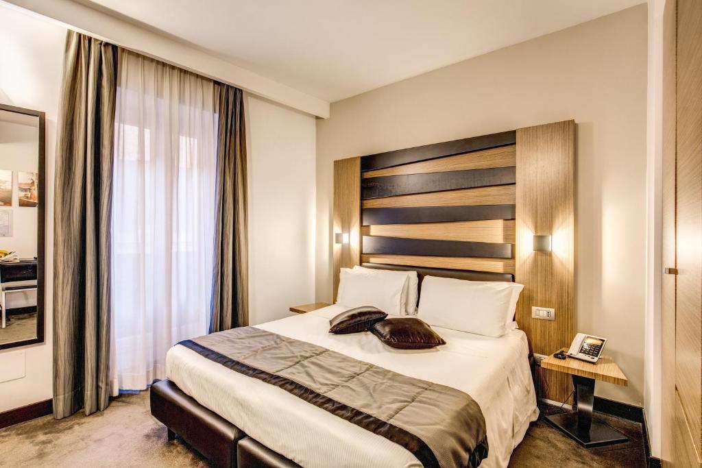 Postel nebo postele na pokoji v ubytování Hotel Trevi - Gruppo Trevi Hotels