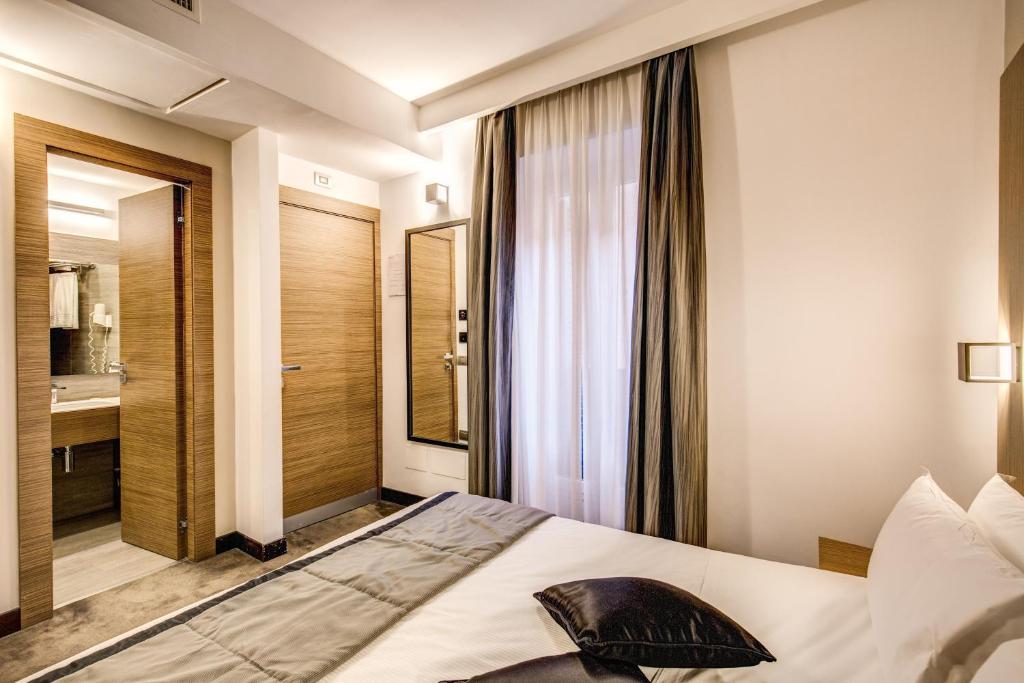 Postel nebo postele na pokoji v ubytování Hotel Trevi - Gruppo Trevi Hotels