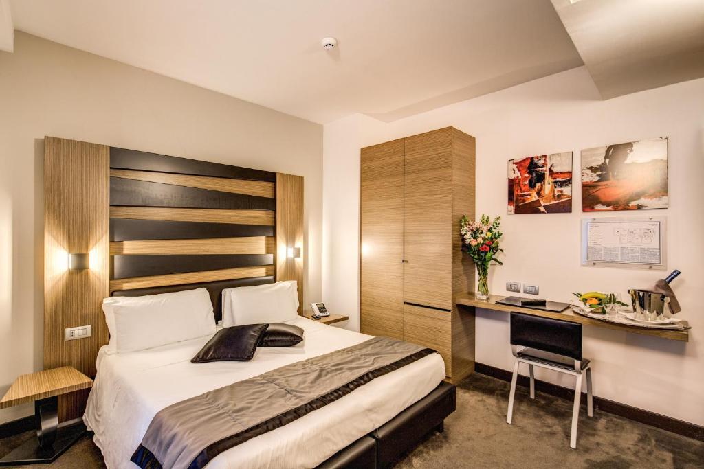 Postel nebo postele na pokoji v ubytování Hotel Trevi - Gruppo Trevi Hotels