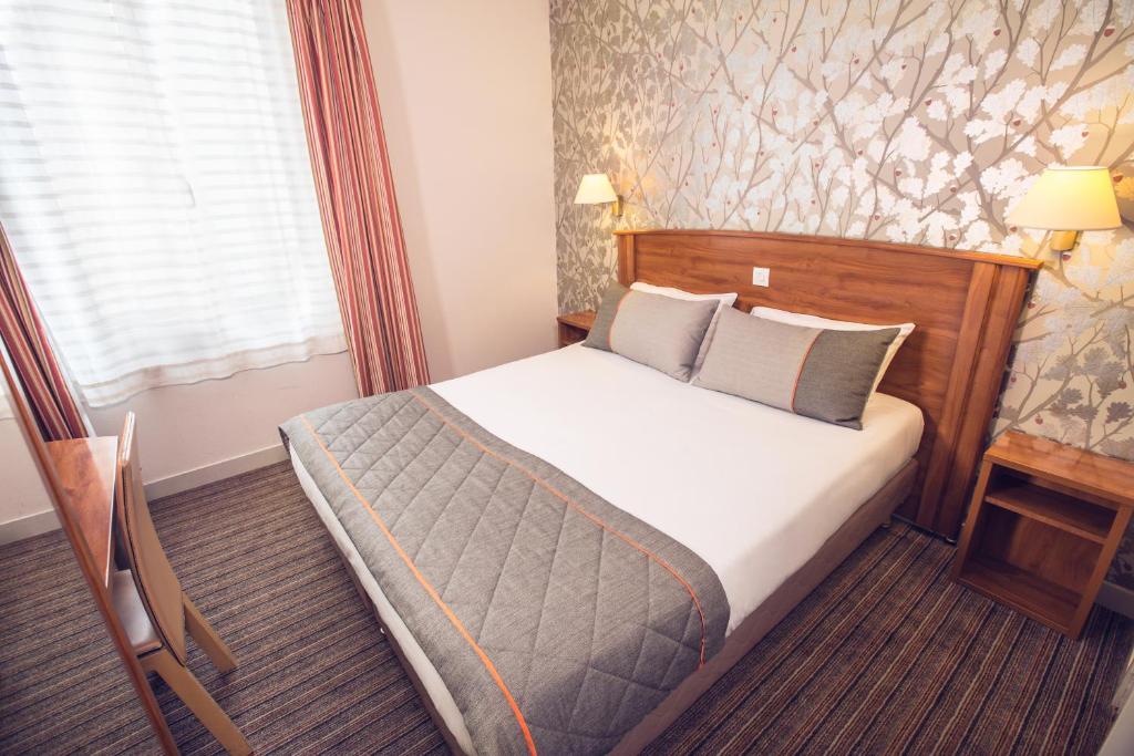 Postel nebo postele na pokoji v ubytování Timhotel Tour Eiffel