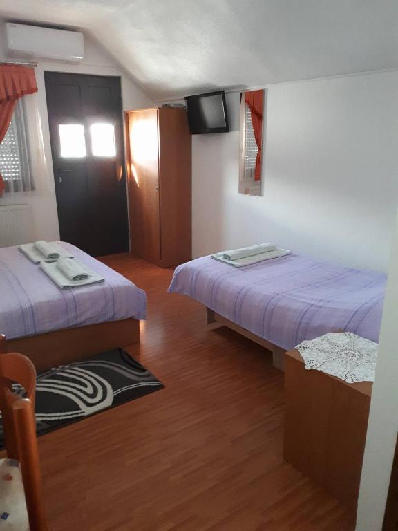 Postel nebo postele na pokoji v ubytování Guesthouse Andja