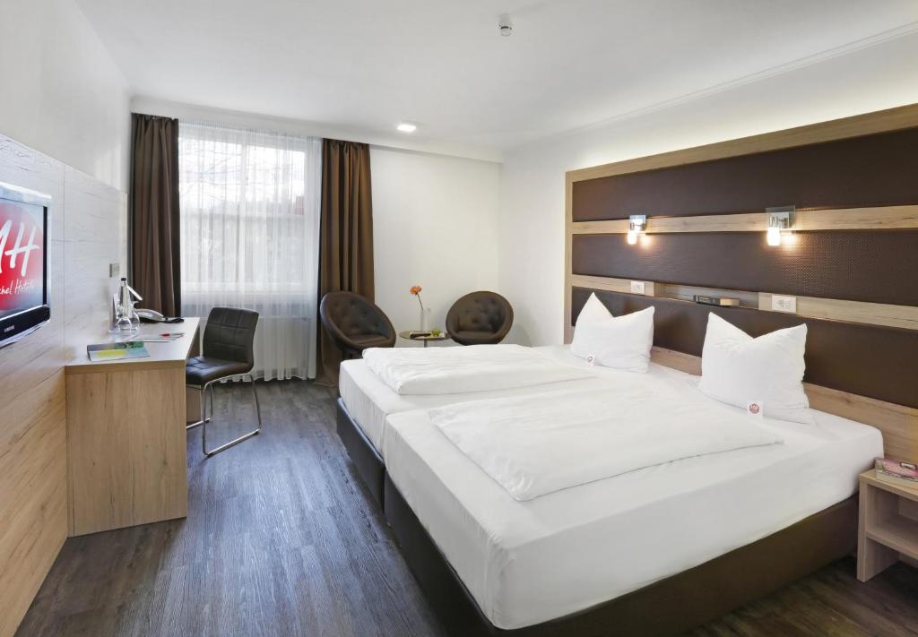 TV a/nebo společenská místnost v ubytování Roomingtons Kaiserhof Landshut