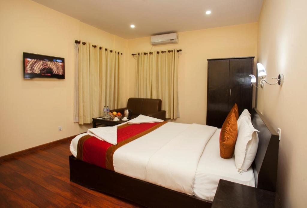 Postel nebo postele na pokoji v ubytování Hotel Dream City