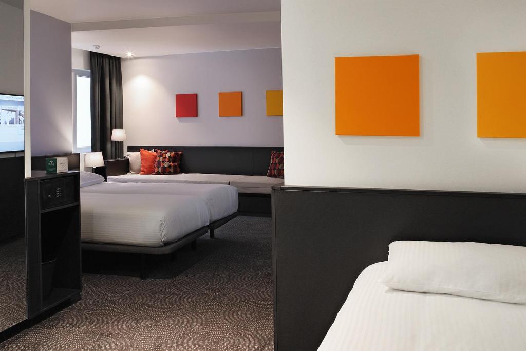 Postel nebo postele na pokoji v ubytování Hotel Van Belle