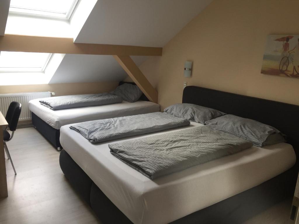 Postel nebo postele na pokoji v ubytování Hotel Amy