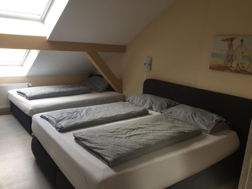 Postel nebo postele na pokoji v ubytování Hotel Amy
