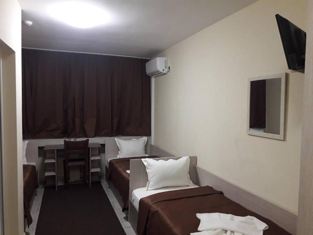 A bed or beds in a room at Hostel Penev